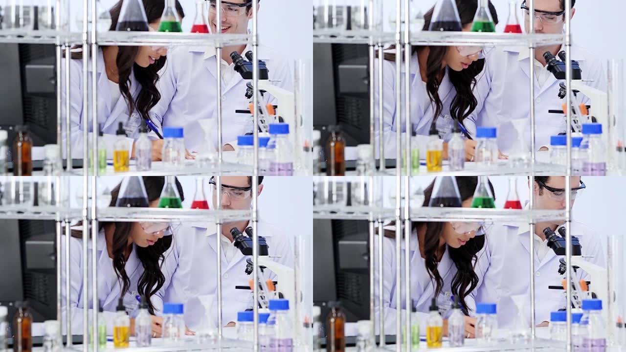 男科学家和女科学家都在实验室工作。在生命科学实验室工作的卫生保健研究人员。