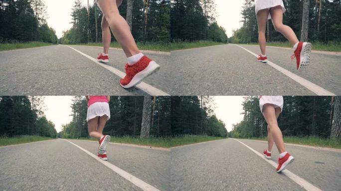 女性腿开始慢动作跑步。女运动员慢跑。