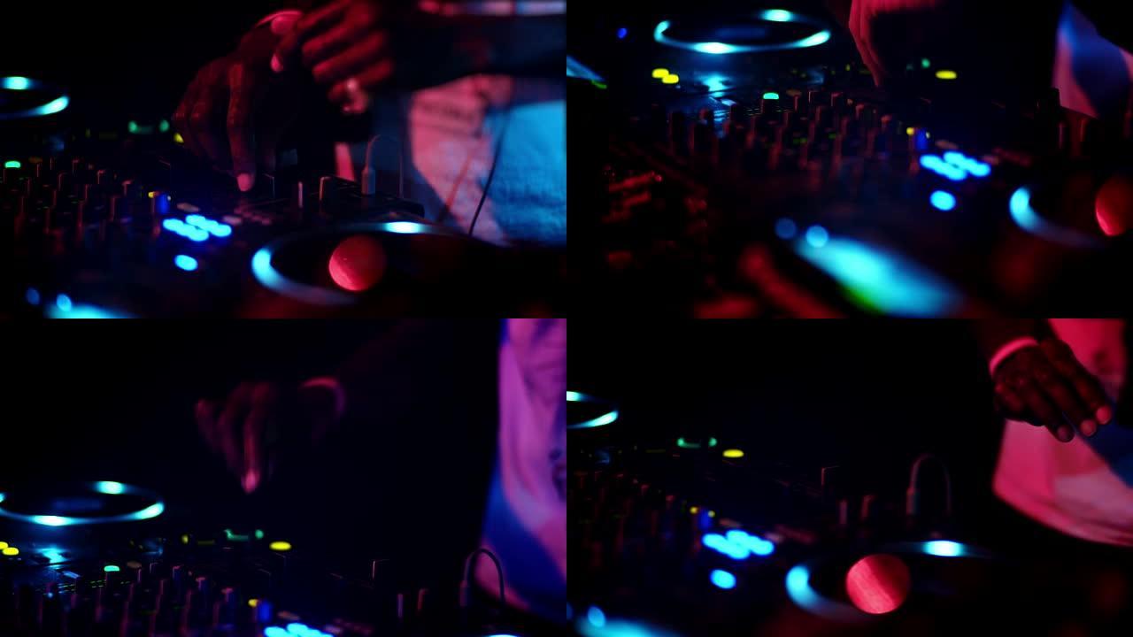 DJ在俱乐部特写镜头中混合音乐。