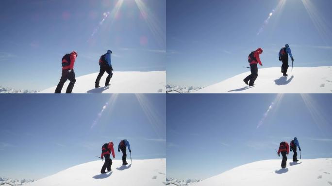 登山者在白雪覆盖的山上行走