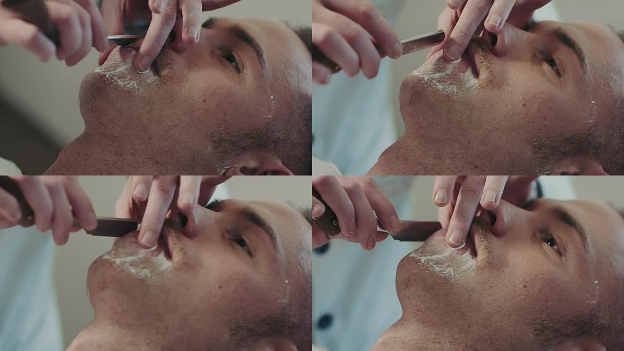 理发师刮胡子躺着刮胡子视频素材美容理发