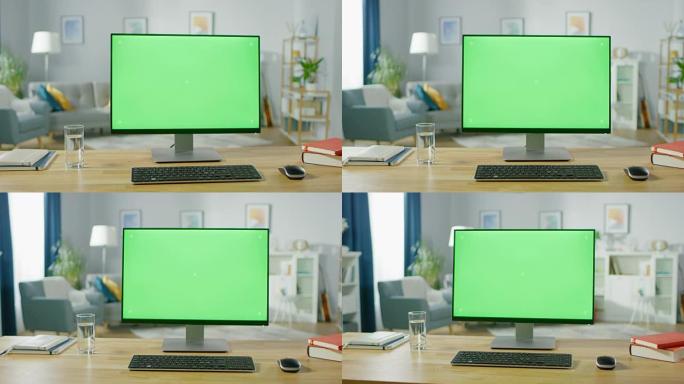 在著名设计师舒适的家庭办公室客厅中，带有模拟绿屏显示屏的个人计算机站在桌子上。