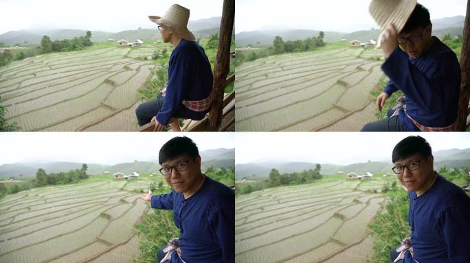 农民在稻田上炫耀自己的工作