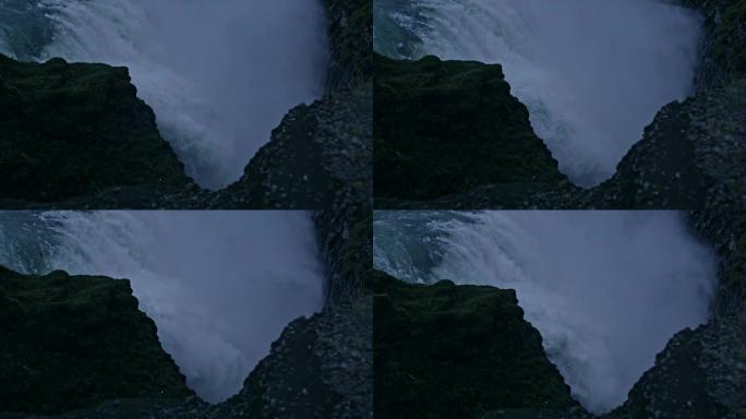 被岩石包围的瀑布泄洪汹涌水流高山