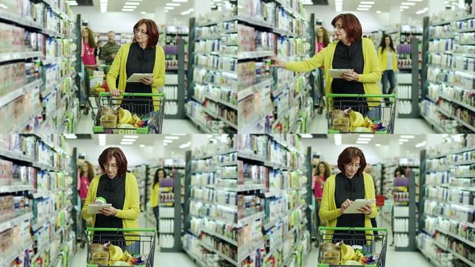 在超市用数字平板电脑购物的女性