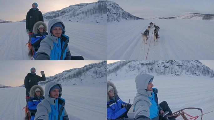 SLO MO POV游客在挪威玩有趣的狗拉雪橇