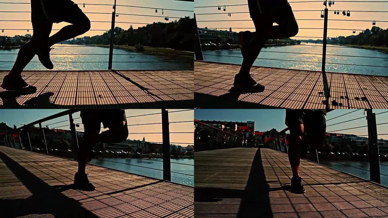 SLO MO运动员在黄昏时慢跑过桥