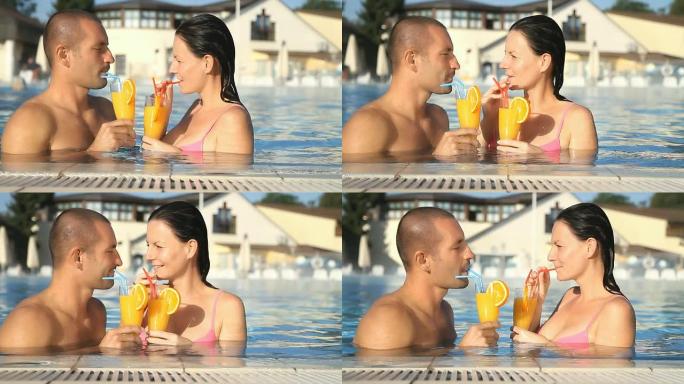 HD：情侣在泳池里喝鸡尾酒
