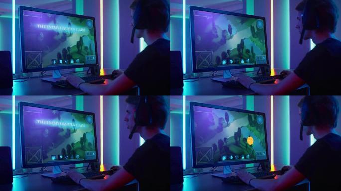 职业玩家在他的个人计算机上玩MMORPG/战略在线视频游戏的弧光。屏幕上显示的游戏。在线网络电子竞技