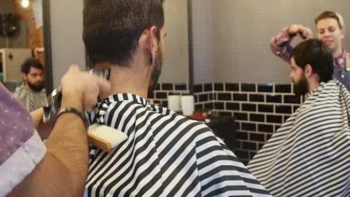 理发师用电动剃须刀修剪客户的头发