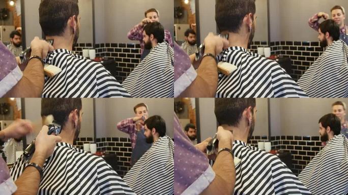 理发师用电动剃须刀修剪客户的头发