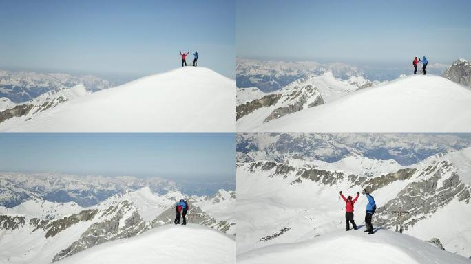 登山者在白雪覆盖的山峰上欢呼雀跃