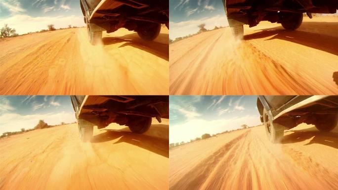 在非洲的沙漠中越野。踩在轮胎上的特写镜头。