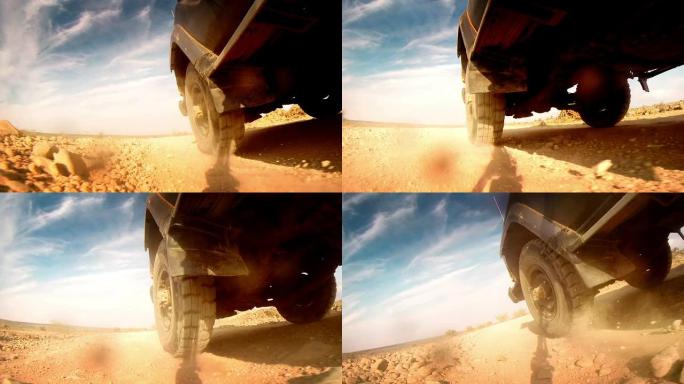 在非洲的沙漠中越野。踩在轮胎上的特写镜头。