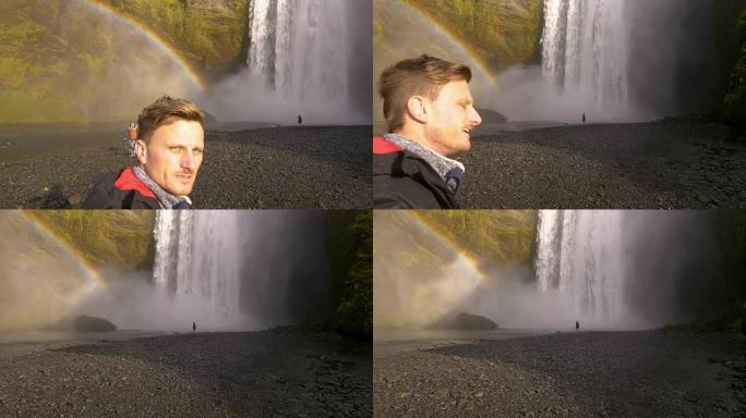 男子在强大的Skogafoss瀑布上自拍照
