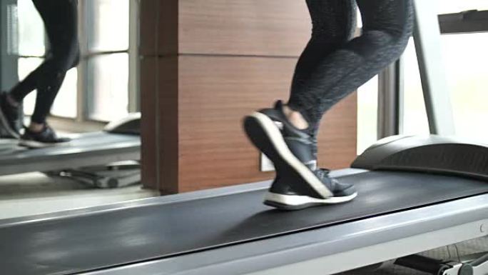 腿部妇女在跑步机上锻炼