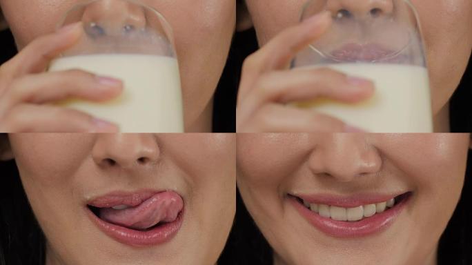 喝牛奶的迷人亚洲女人。特写。