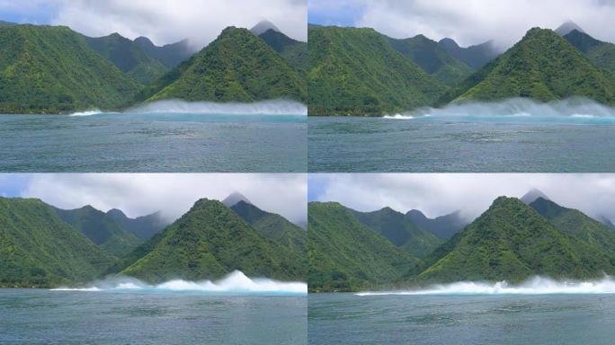 慢动作: 巨大的汹涌海浪冲向一个多山的异国岛屿。