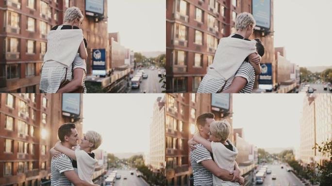 慢动作快乐的年轻人遇见他的女朋友，抱着她，在令人惊叹的纽约日落大桥上旋转