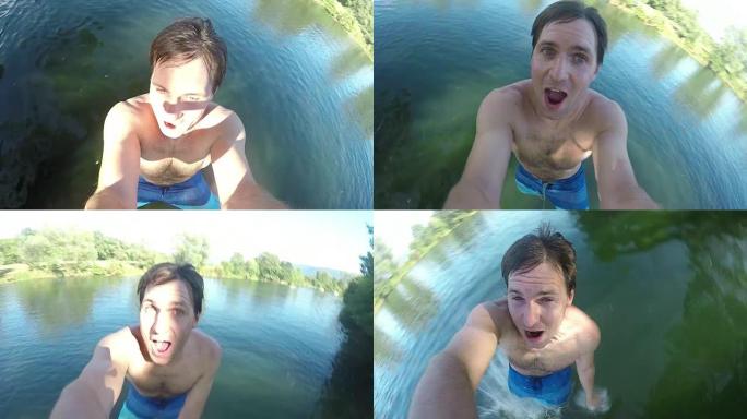 自拍照: 精力充沛的年轻游客在绳索秋千上摇曳，跳入宁静的河流。