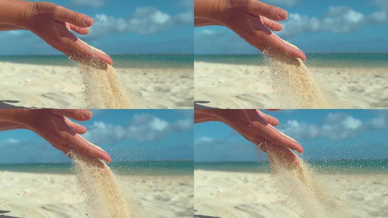 特写: 在阳光明媚的海滩上，微小的沙粒从女孩的手中吹走。