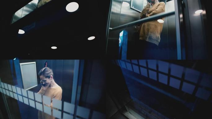 年轻快乐轻松的高加索女孩坐在透明的玻璃墙电梯里微笑着说话