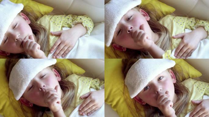 生病躺在床上的小女孩。
