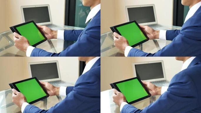 商人使用绿屏平板电脑