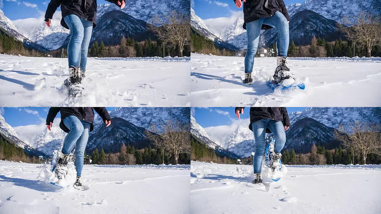 女人在雪山边扫雪冬季景色女人雪中行走