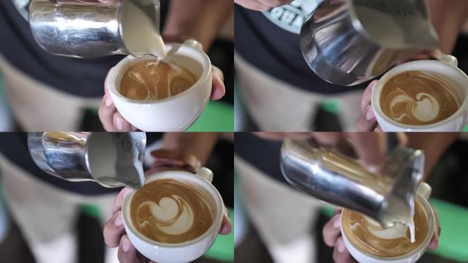 咖啡师在一杯咖啡中加入泡沫牛奶，用于泡沫艺术