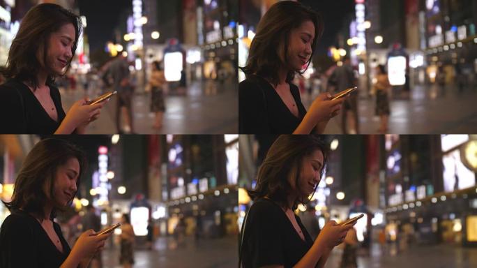 年轻女子在街上看手机，4k