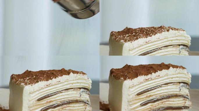 在可丽饼蛋糕上浇上巧克力糖霜的CU镜头