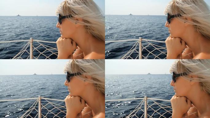 高清：在帆船甲板上沉思的女人
