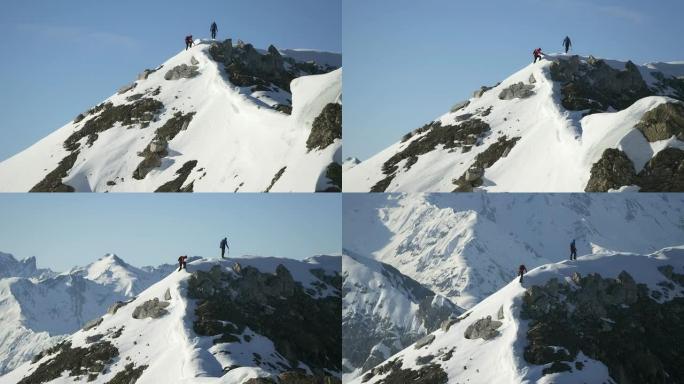 爬上白雪覆盖的山顶的登山者