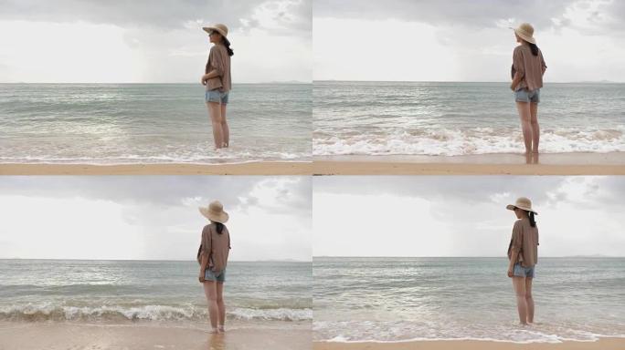 站在海滩上的女人站在海滩上的女人眺望海边