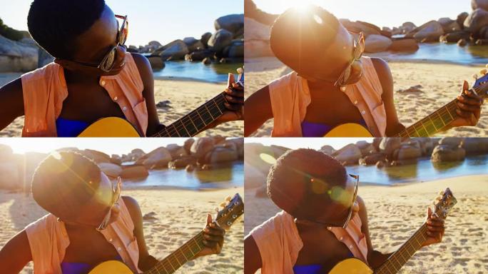 女人在海滩弹吉他4k