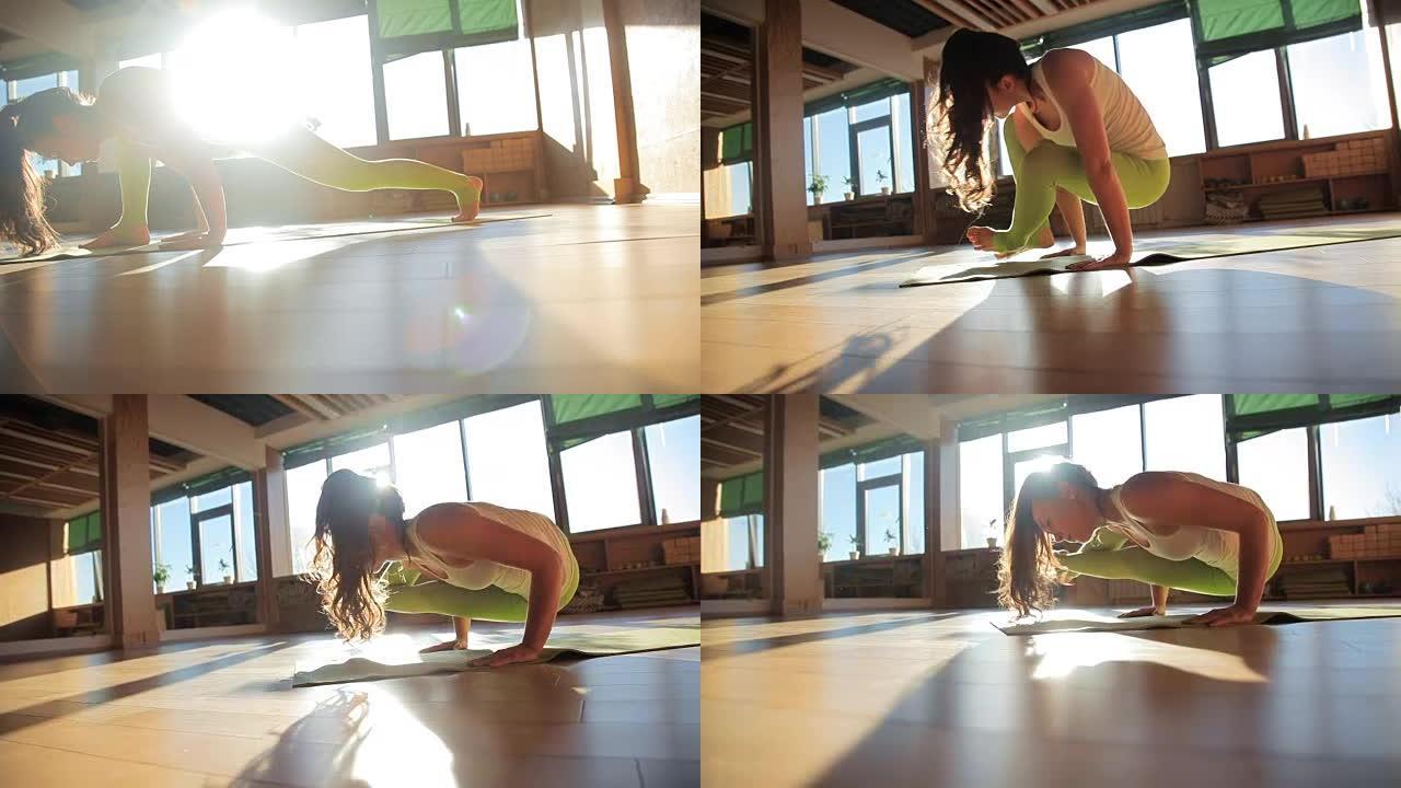 一位30多岁的私人教练在瑜伽工作室的垫子上做体式