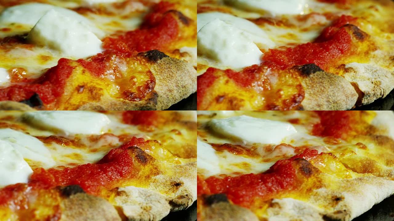 高品质披萨典型的意大利食物，搭配意大利马苏里拉奶酪和新鲜收获的新鲜番茄酱，配以芬芳的罗勒叶。