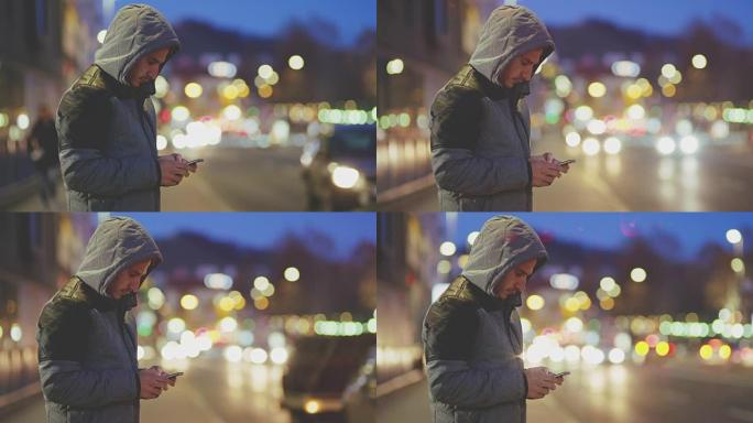 DS年轻人在人行道上使用智能手机