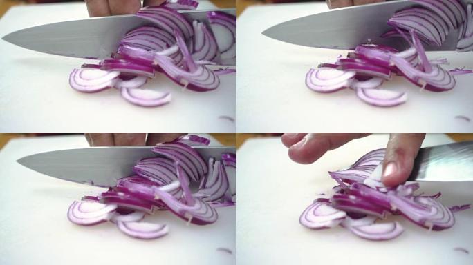 慢动作-在厨房的切菜板上制作沙拉健康食品和切碎洋葱的首席人物的特写镜头。