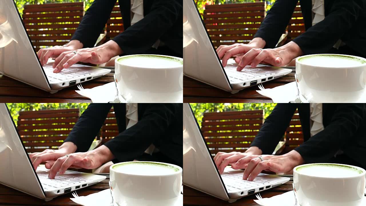 4K: 女商人在咖啡店里使用笔记本电脑