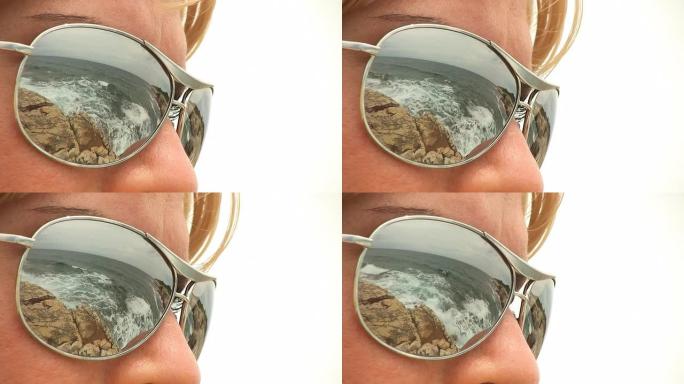 高清: 太阳镜与海滩场景的反射
