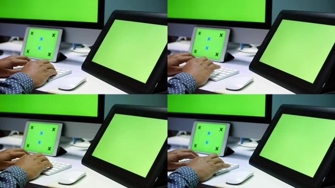 4K: 业务人员使用笔记本电脑和数字平板电脑，绿屏