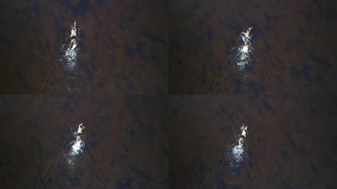 那个在水里游泳的人。四轴飞行器射击