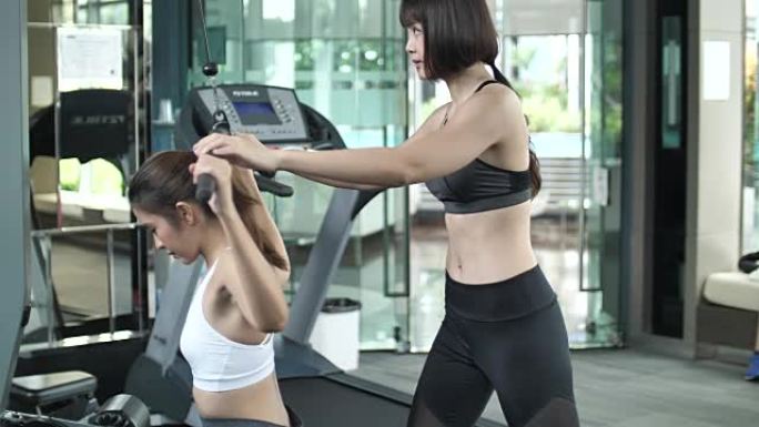 亚洲女性在健身房锻炼，健身教练，慢动作