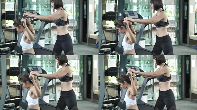亚洲女性在健身房锻炼，健身教练，慢动作