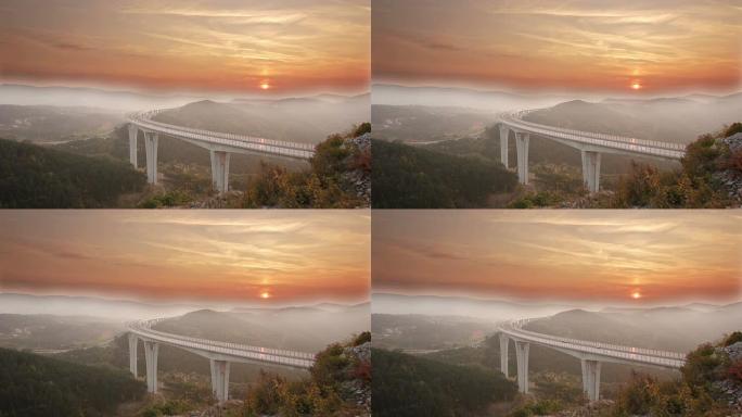 日落时分，车辆在高架桥上飞驰而过，薄雾笼罩