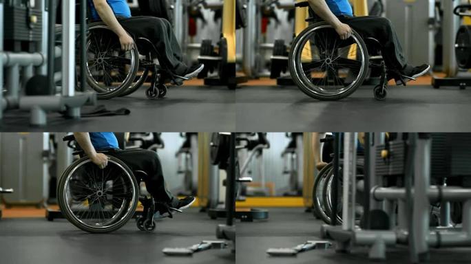 无法识别的截瘫男子在健身房骑行