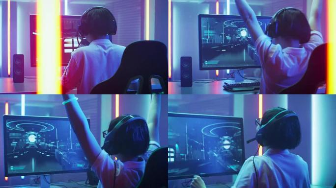 专业玩家在他的个人电脑上玩并赢得第一人称射击游戏在线视频游戏。他正在通过耳机与他的团队交谈。复古拱廊