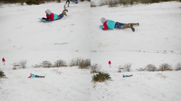 十几岁的男孩在雪地里使用身体板